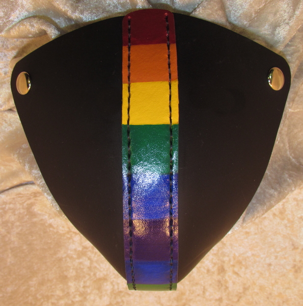 Black sides with a center front stripe painted in repeating rainbow stripes.
