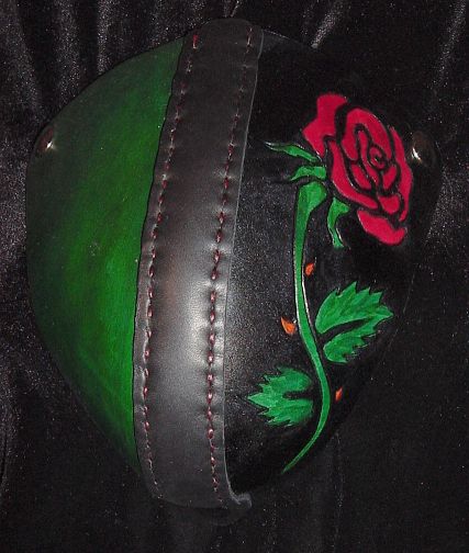 Rose on black, with green side, codpiece.